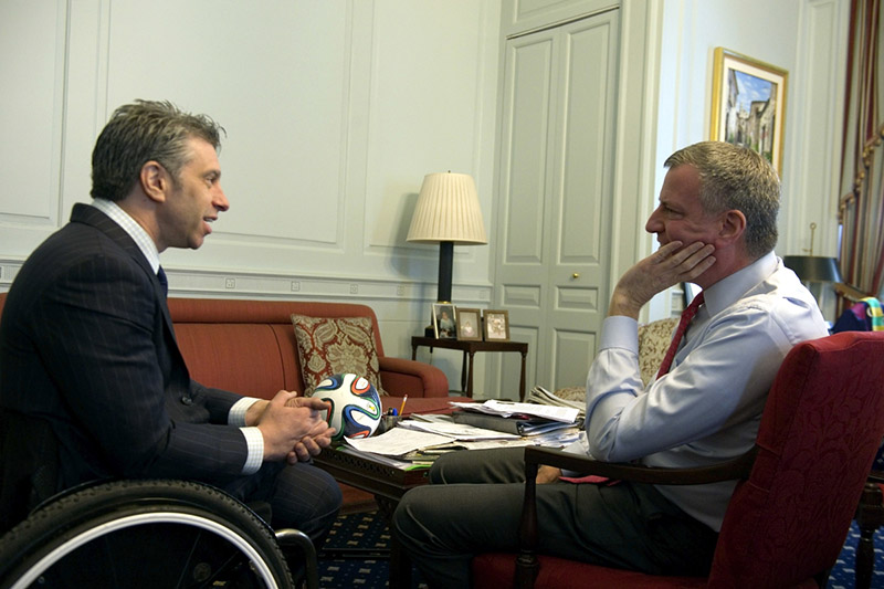 Victor Calise in a wheel chair with Mayor De Blasio